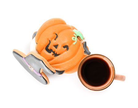 Halloween cookies and cup of tea on white backgroundの写真素材