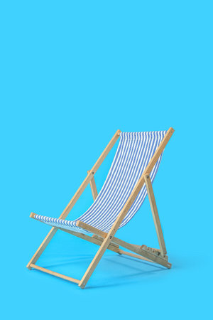 Beach deck chair on light blue backgroundの写真素材
