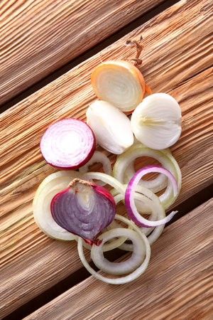 fresh cut onion on wooden backgroundの写真素材