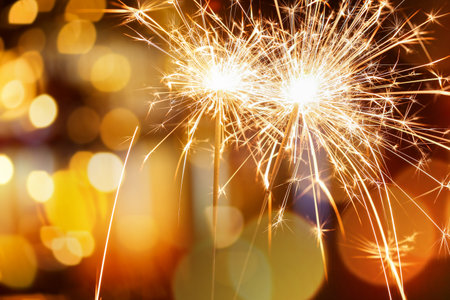 Beautiful Christmas sparklers at night outdoors, closeupの写真素材