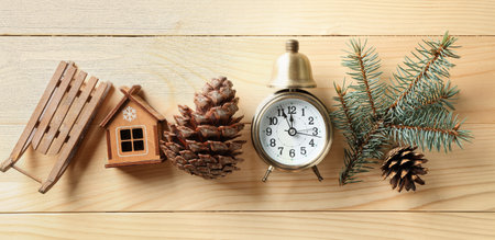 Alarm clock with decorations on wooden background. christmas count downの写真素材