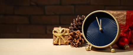 Alarm clock with gifts on table. Christmas count downの写真素材