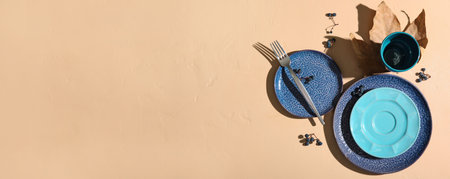 Autumn table setting on beige background with space for textの写真素材