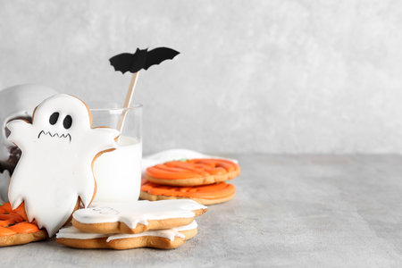 Halloween cookies with glass of milk on grunge backgroundの写真素材