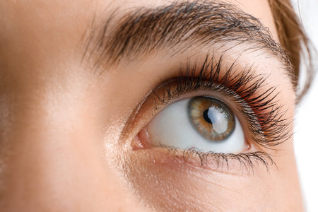 Young woman with beautiful hazel eyes on white background, closeupの写真素材