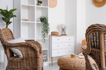 Interior of cozy living room with rattan armchairs and tableの写真素材