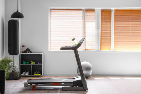 Interior of modern gym with treadmill and boxing pearの写真素材