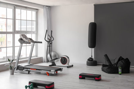 Interior of modern gym with treadmill and sport equipmentの写真素材