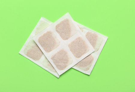 Mustard plasters on green background