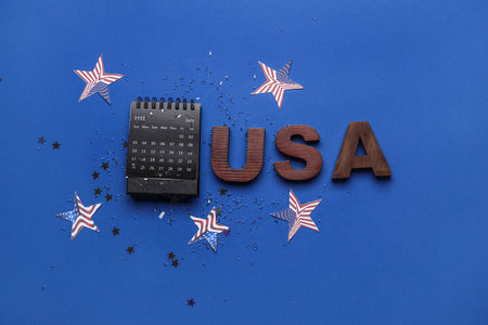 Calendar with word USA, stars and confetti on blue background. independence dayの写真素材
