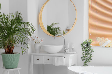 Modern sink and mirror near white wall in bathroomの写真素材