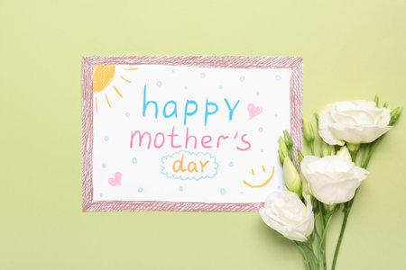Card with text HAPPY MOTHER'S DAY and white flowers on green backgroundの写真素材