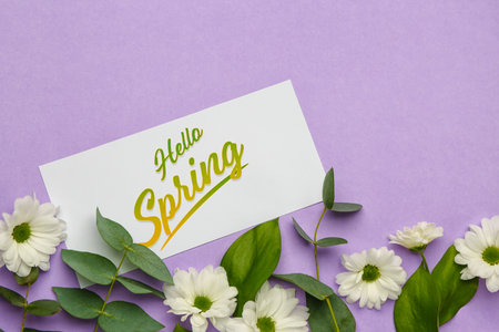Card with text HELLO SPRING and floral decor on lilac background, closeup