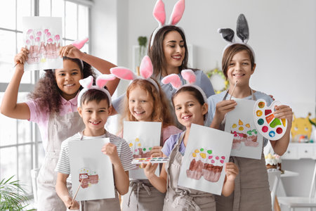 Children and teacher during master-class in art on Easter eveの写真素材
