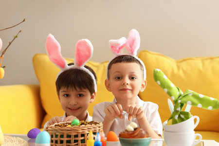 Cute little boys celebrating Easter at home