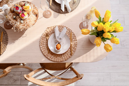 Plate with egg on dining table served for Easter celebration