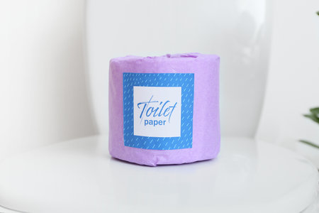 Paper roll on toilet bowl, closeup