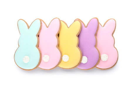 Delicious Easter cookies in shape of bunny on white background
