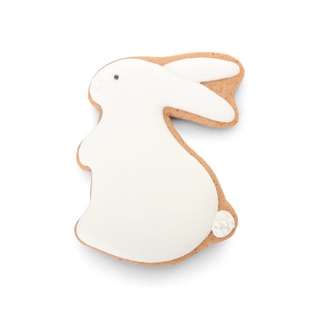 Delicious Easter cookie in shape of bunny on white background