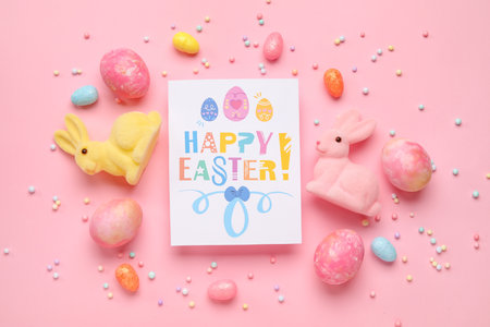 Beautiful Easter composition with greeting card, painted eggs and bunnies on pink background