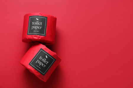 Toilet paper rolls on red background