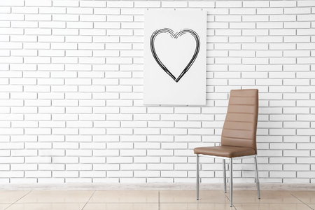 Modern chair and poster hanging on white brick wallの写真素材