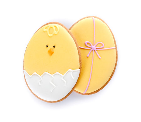 Different delicious Easter cookies in shape of eggs on white background