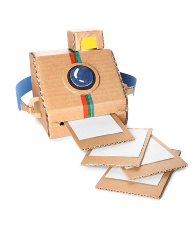 Cardboard photo camera with pictures on white backgroundの写真素材