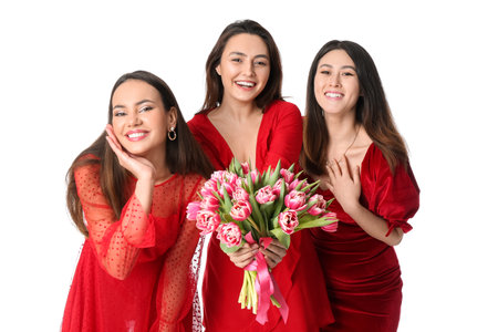 Beautiful young women with flowers on white background. International Women's Day celebrationの写真素材