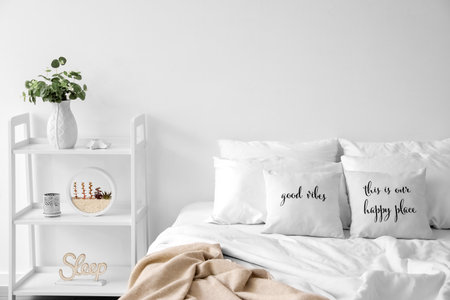 Interior of modern bedroom in white colorsの写真素材