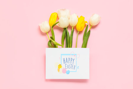 Beautiful Easter composition with greeting card on color background