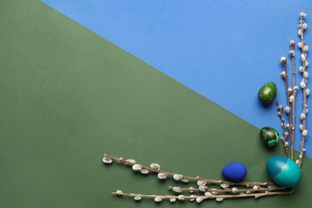 Composition with Easter eggs and pussy willow branches on color backgroundの写真素材