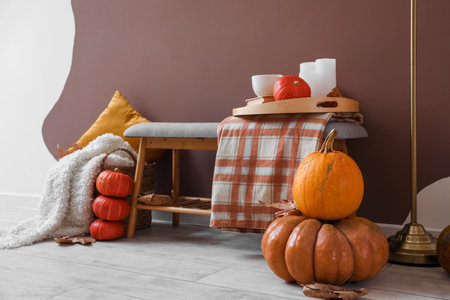 fresh pumpkins on floor in stylish roomの写真素材
