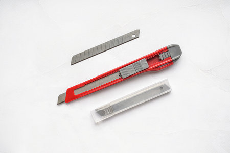 Utility knife with blades on white background
