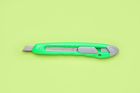 utility knife on green backgroundの写真素材