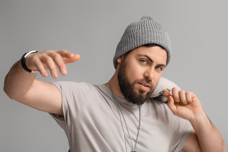 Stylish cool bearded man on gray backgroundの写真素材