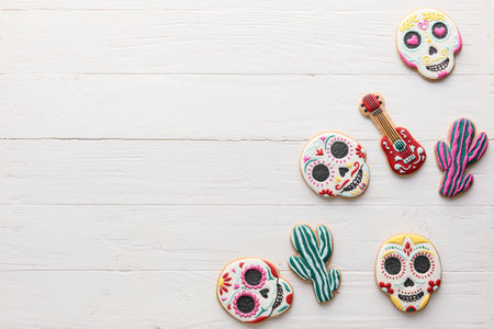 Tasty cookies on white wooden background. El Dia de Muertosの写真素材