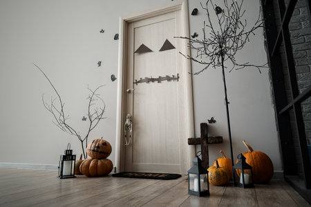 Interior of light hall decorated for Halloween with door and tree floor lampの写真素材