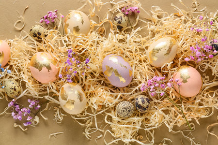 Composition with beautiful Easter eggs and gypsophila flowers on color background