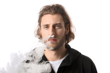 Smoking young man isolated on white