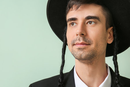 Hasidic Jewish man on color backgroundの写真素材