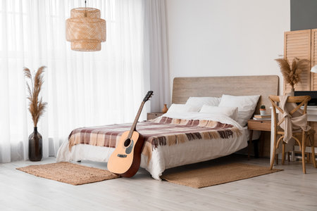 Interior of modern bedroom with guitarの写真素材