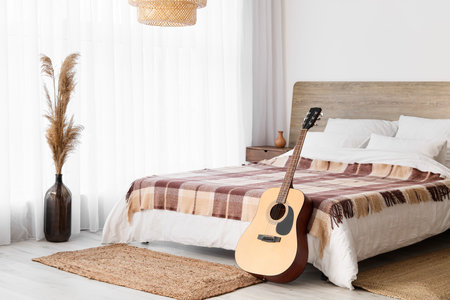 Interior of modern bedroom with guitarの写真素材