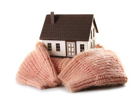 House model with beige sweater on white background. heating conceptの写真素材