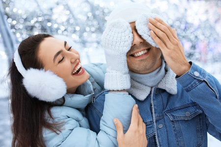 Pair of sweethearts on snowy winter day, closeup