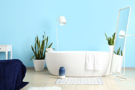 Modern bathtub in stylish roomの写真素材