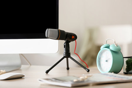 Modern microphone on table in room, closeupの写真素材