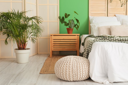 Interior of modern bedroom with green wallの写真素材