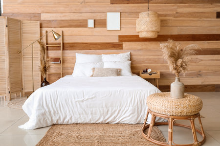 Interior of modern bedroom with wooden wallの写真素材
