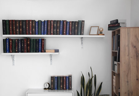 Bookcase with shelves in modern interior of roomの写真素材